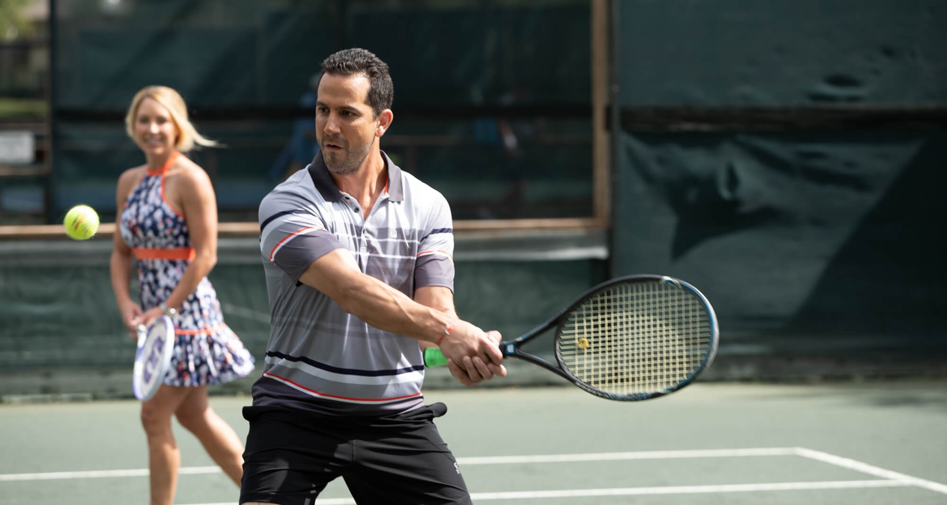 A couple playing tennis